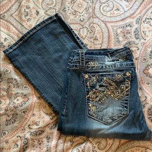 Women’s destructed boot cut jeans